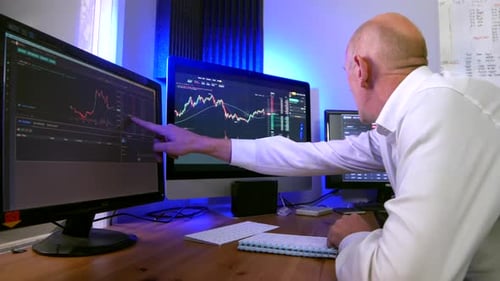 Happy stock trader winds money by trading Forex and cryptocurrency. Close up of a mature businessman