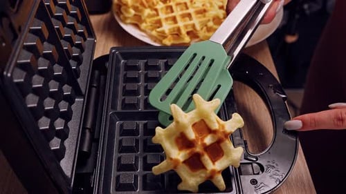 Freshly Made Waffle Removed from Waffle Iron