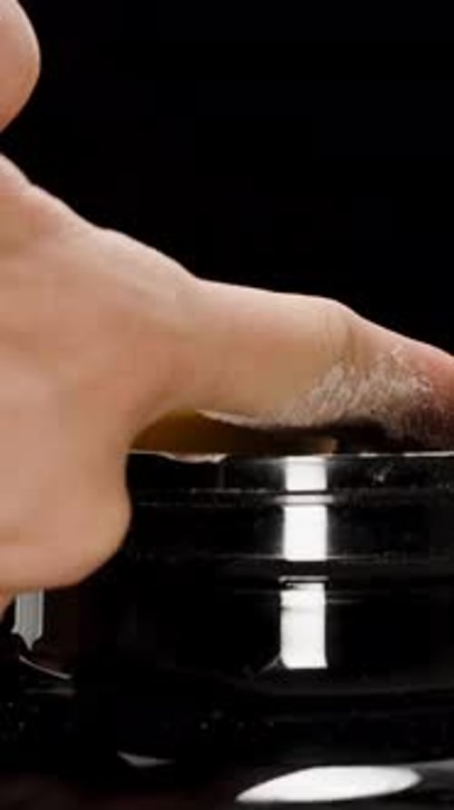 Vertical video. Man Uses Finger to Level Protein Powder on a Measuring Spoon but Still Pours.