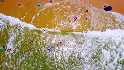 Aerial Top view of a transparent blue sea with beautiful waves at sunny day in summer. air of ocean