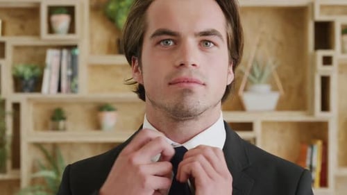 Man, face and corporate style in a suit with a businessman adjusting his tie in the office