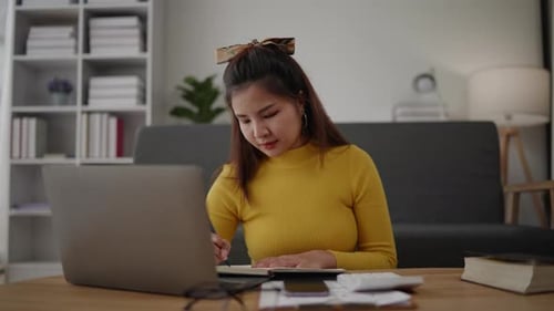 Woman Working on Laptop in Cozy Home Interior