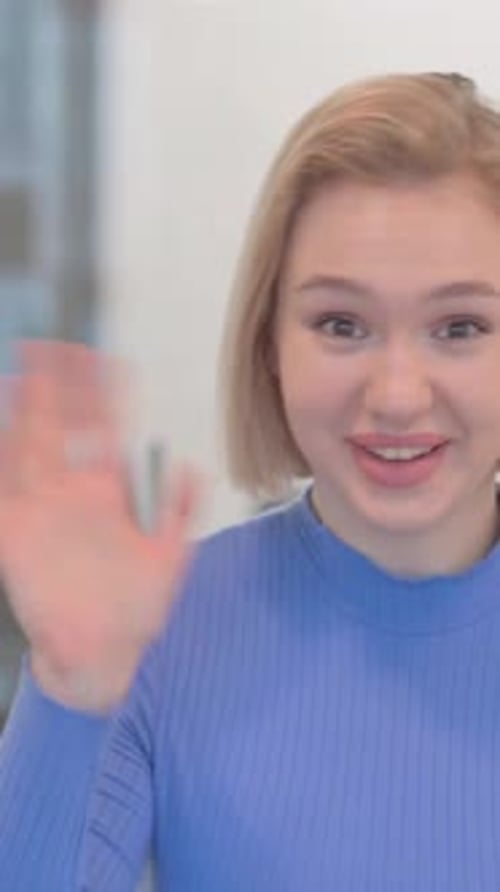Blogging Young Woman Doing Video Chat in Office, vertical video