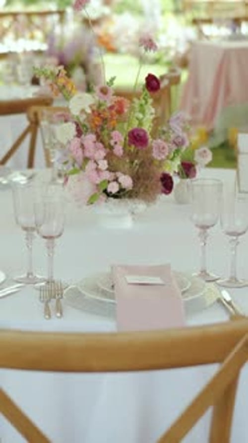 Elegant Wedding Table Arrangement with Floral Centerpiece
