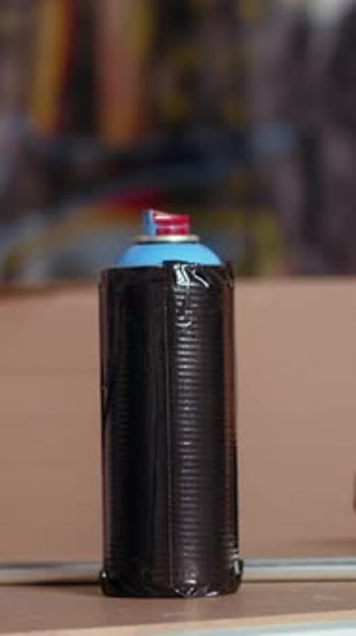 Vertical Video Focus on Paint Cans in Underground Place Used As Crime Haven