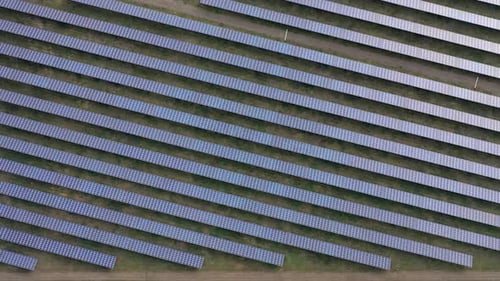 aerial top view of solar panels farm solar cell with sunlight drone flight over solar panels field r