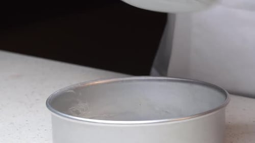 Chef Prepares Cake Pan for Baking Dessert