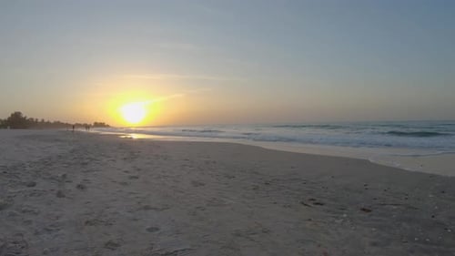 Beautiful sunset on tropical beach with calm sea