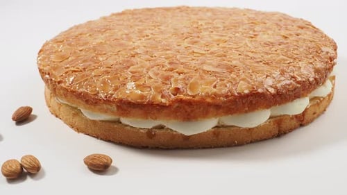 Delicious Almond Cake Close Up on White Background