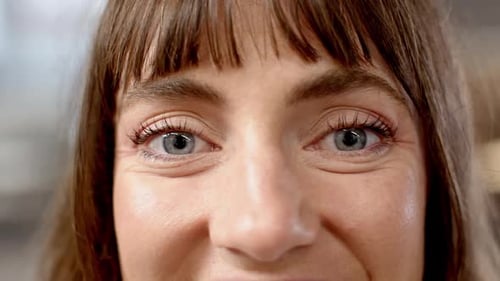 Close-up of woman's eyes and face, focusing on expression and detail