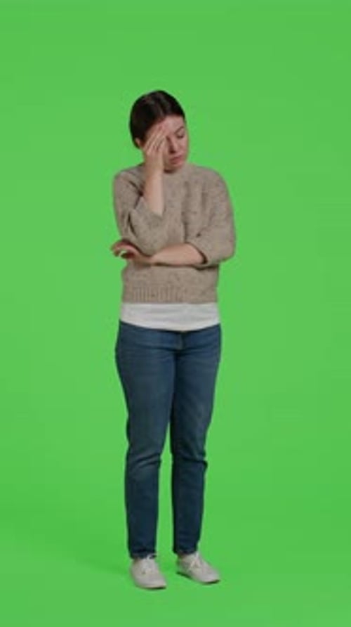 Vertical Video Side View of Hurt Adult Dealing with Headache Over Greenscreen Backdrop