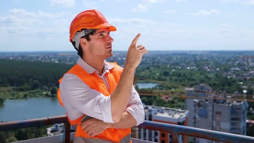Young Construction Supervisor on Building Rooftop