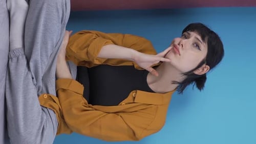 Thoughtful Woman Posing with Hand on Face