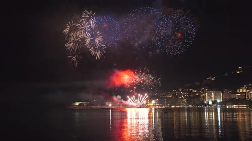 Fireworks with Colorful Lights Over Sea