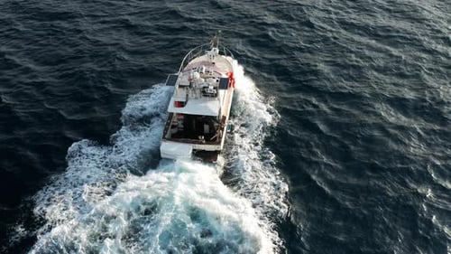 Backwash From A Speedboat heading Out For Fishing In Adriatic Sea At Sunrise In Croatia. - aerial