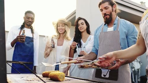 Friends Enjoying Barbeque on a Sunny Rooftop