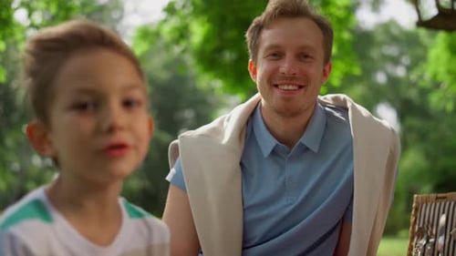 Winking Happy Man Laughing on Camera on Nature Close Up. Smiling Father