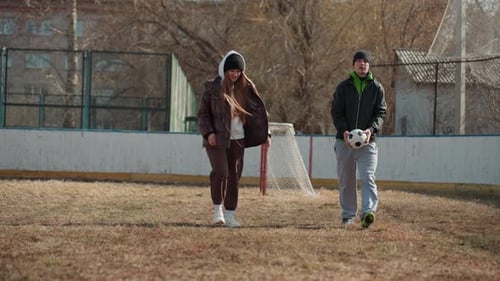 Teenagers Hanging Out and Playing With Soccer Ball