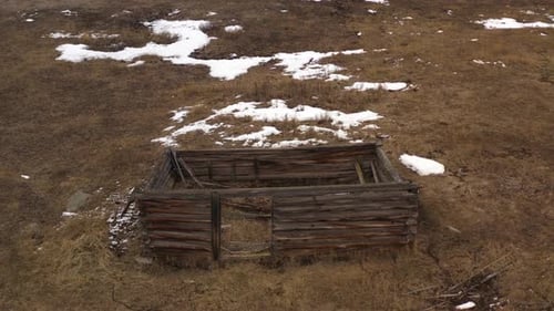Forgotten Beauty: An Abandoned Log Cabin in a Snowy Field in British Columbia