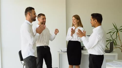 Smiling Coworkers Celebrate in Office