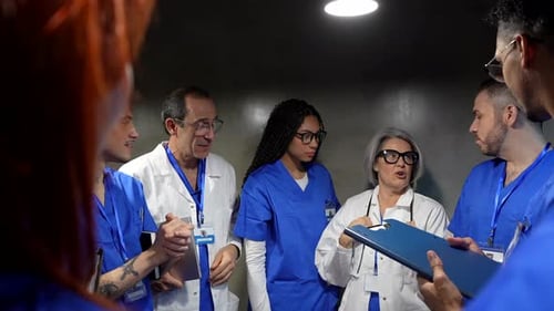 Medical team discussing patient case during a hospital meeting