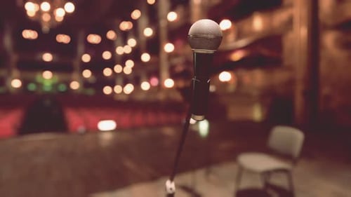 Professional Microphone on Stage Lights Background