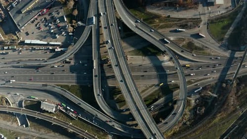 Aerial view of highway road interchange with busy urban traffic