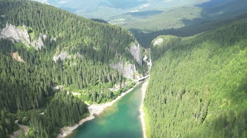 Landscape Of Lake Between Mountains