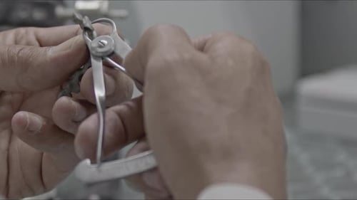 Dental Technician Precise Work on Medical Device