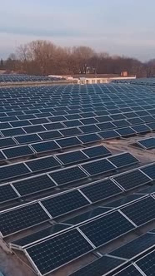 Solar panels on rooftop. Aerial view of solar panels on factory roof