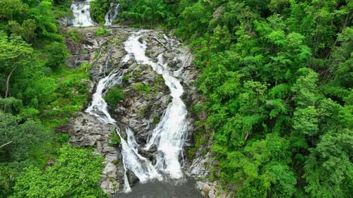 Scenic jungle waterfall from above. Aerial view.