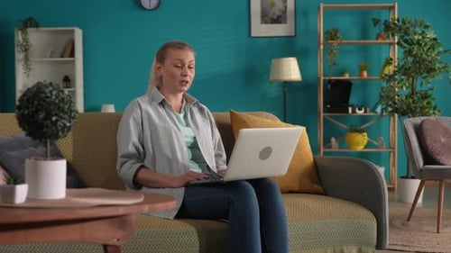 Woman Talking During a Video Call on Laptop