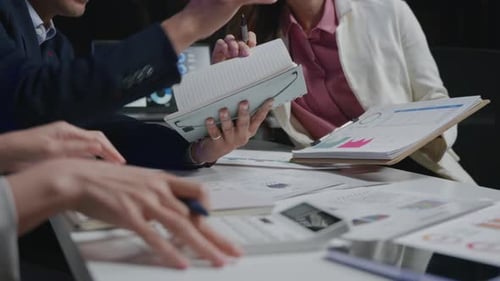 businesspeople working and brainstorming in office