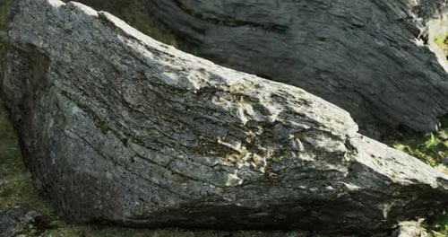 Unique Rock Formations Highlighted By Natural Light in a Serene Landscape