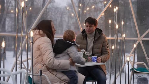 Family Togetherness in Urban Dome with Decorative Lights