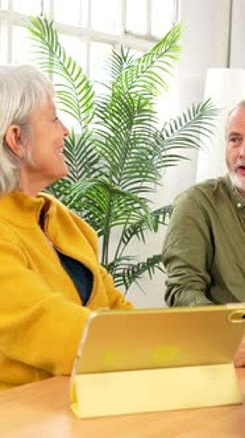 Lovely Mature Couple Enjoying Morning Coffee at Home