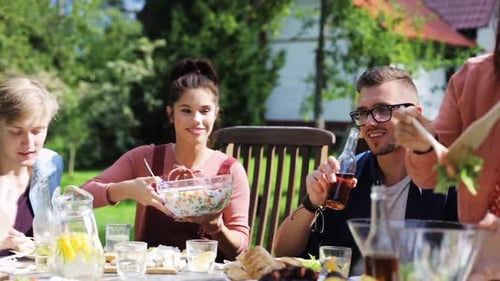 Friends Enjoying a Summer Meal Outdoors