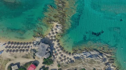Aerial Footage of Turquoise Sea and Beach Umbrellas Landscape