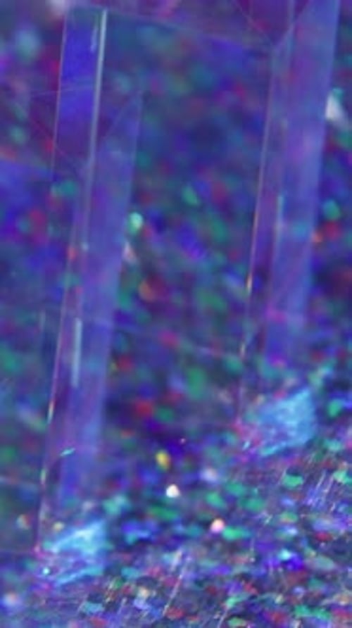 Abstract footage of transparent shapes and colorful glitter