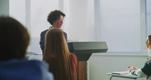Confident Female Educator Leads Classroom Discussion With Enthusiasm and Empathy