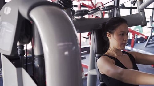 Sporty Asian Woman Exercise Training Building Muscles and Burning Fat Cardio