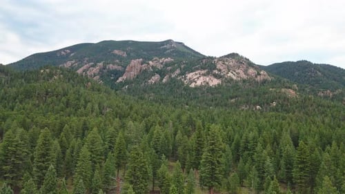 Aerial reveal of remote mountain cliffs in a Colorado wilderness area.