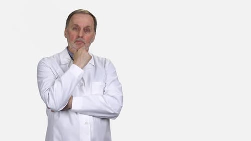 Adult Male Doctor Thinking Intensely on White Background
