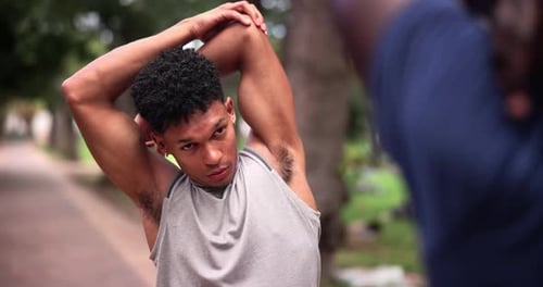 Nature, fitness and man with warm up for arms for exercise in outdoor park, field or garden