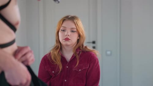 Woman Watches Stripper Adjust Trousers in Mirrored Studio