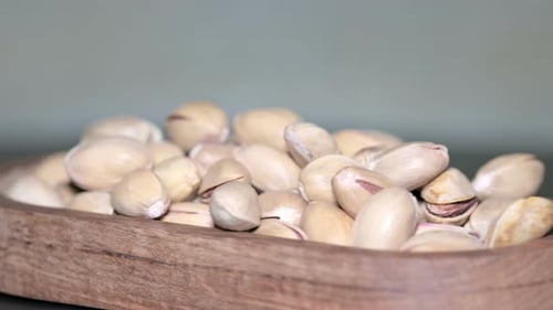 Pistachios in Shells Displayed in Wooden Dish