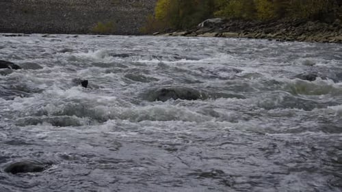 Hand-held shot of water flooding down the river Gorge