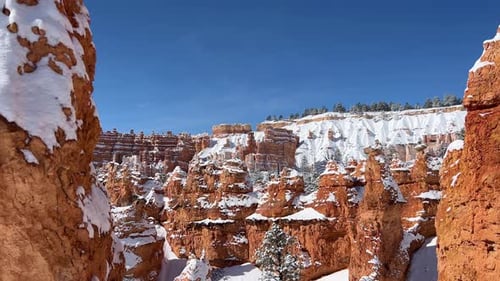 A Stunning Winter Landscape Showcasing Beautifully Snowdusted Rock Formations in the Breathtaking