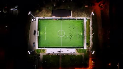 Aerial View of Football Match Taking Place in Georgia During Summer Night