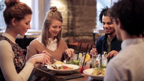 Friends Enjoying Lunch Together in a Modern Restaurant